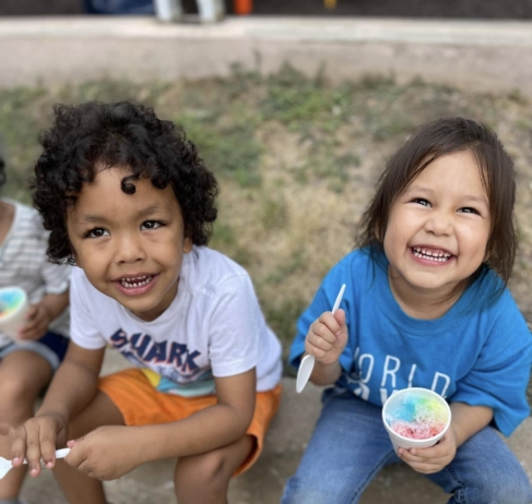 childern smiling with treat at preschool and daycare at cadence academy preschool galleria