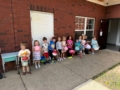 children standing in line outside smiling at preschool and daycare cadence academy preschool 502 spring hill