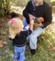 children petting chicken outside at preschool and daycare cadence academy preschool nolensville 504