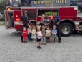 children with firefighters at school visit at preschool and daycare cadence academy preschool 502 spring hill