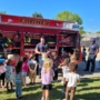 children with firefighters at preschool and daycare at cadence academy preschool forney, texas