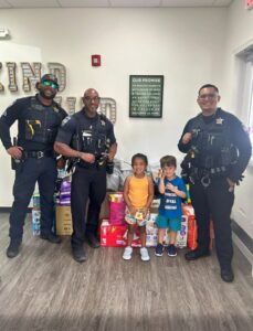 children with police officers at preschool and daycare of 339 wild horse