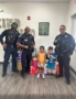 children with police officers at preschool and daycare of 339 wild horse
