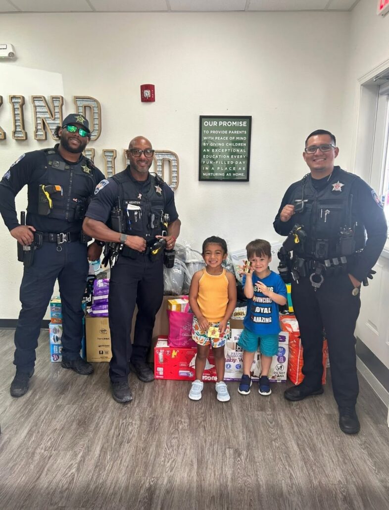 children with police officers at preschool and daycare of 339 wild horse