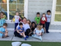 children with teacher adn dog outside building at preschool and daycare cadence academy preschool nolensville 504