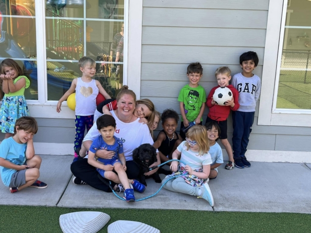 children with teacher adn dog outside building at preschool and daycare cadence academy preschool nolensville 504