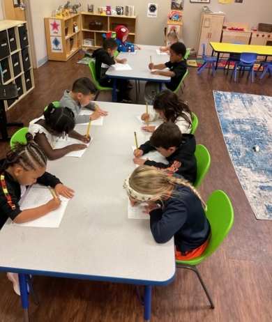 Children working at desk at preschool and daycare at Cadence Academy Preschool Olive Branch, Mississippi