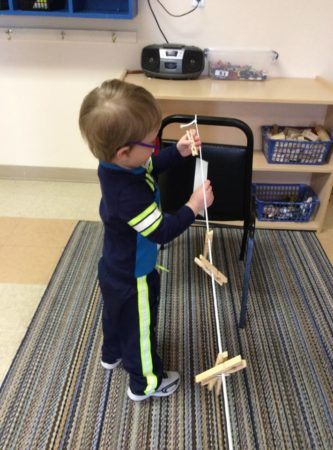 clothesline_motor_skill_activity_cadence_academy_preschool_main_street_normal_il-333x450