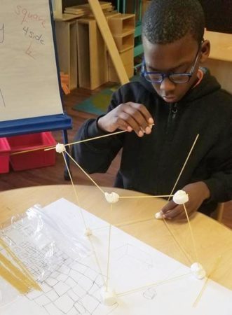 elementary_student_making_spaghettI_cube_sunbrook_academy_at_stockbridge_ga-331x450