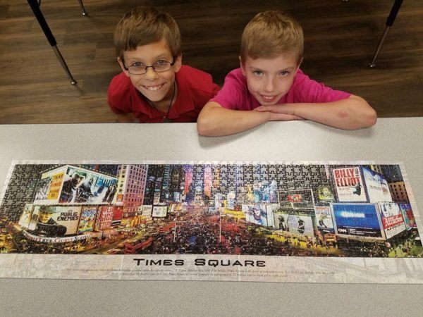 elementary_students_finish_times_square_puzzle-600x450