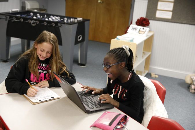 elementary_students_having_fun_while_doing_homework_winwood_childrens_center_leesburg_va-675x450