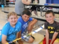 elementary_students_showing_off_elevated_car_track_cadence_academy_before_and_after_school_norwalk_ia-600x450