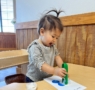 female child engaging in hands on activity at cadence academy wylie texas