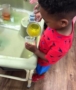 filling_up_cup_with_apple_juice_cadence_academy_preschool_lincoln_ri-380x450