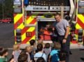 fireman_showing_preschool_children_back_of_the_fire_truck_cadence_academy_preschool_greenville_sc-603x450