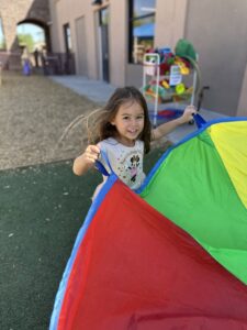 female child playing outside having fun at cadence academy chandler heights