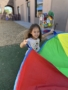 female child playing outside having fun at cadence academy chandler heights