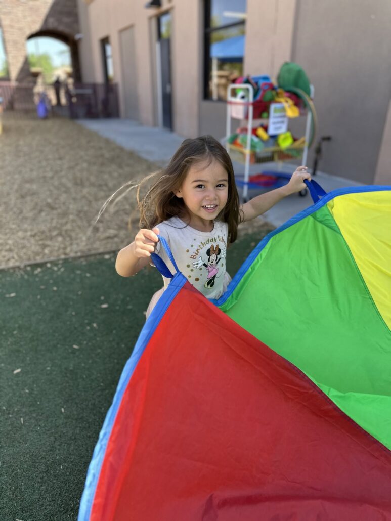 female child playing outside having fun at cadence academy chandler heights
