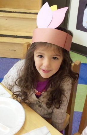 girl_celebrating_thanksgiving_at_carolina_kids_child_development_center_fort_mill_sc-293x450