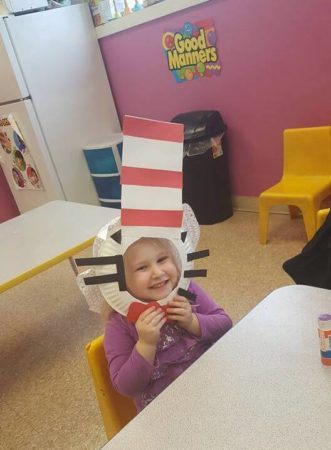 girl_enjoying_cat_in_the_hat_craft_prime_time_early_learning_centers_middletown_ny-331x450