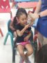 girl_petting_snake_cadence_academy_preschool_greensboro_nc-338x450