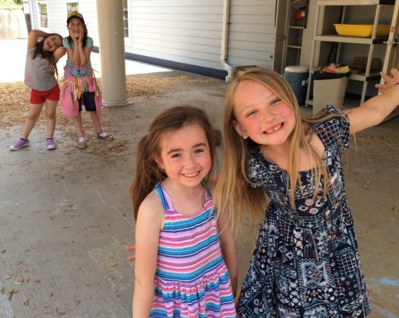 girls_being_silly_on_playground_at_cadence_academy_preschool_dupont_wa-565x450