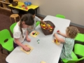 Group of children doing hands on activity at Cadence Academy Preschool Olive Branch, Mississippi