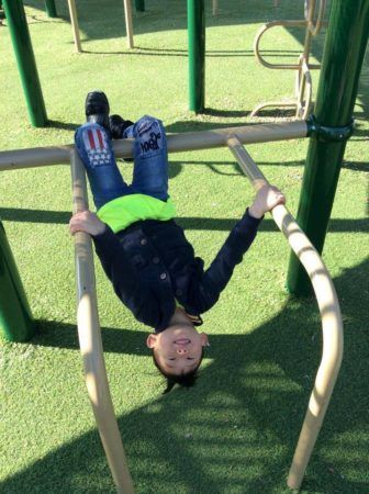 hanging_upside_down_on_playground_at_bent_tree_child_development_center_addison_tx-336x450