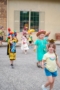 happy school age children in parade at preschool and daycare of 339 wild horse