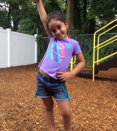 happy_pre-kindergarten_girl_on_playground_at_cadence_academy_preschool_seekonk_ma-402x450