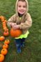 happy_preschool_boy_holding_pumpkin_cadence_academy_preschool_east_greenwich_ri-296x450