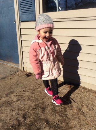 happy_preschool_girl_walking_on_the_playground_at_cadence_academy_preschool_north_attleborough_ma-334x450