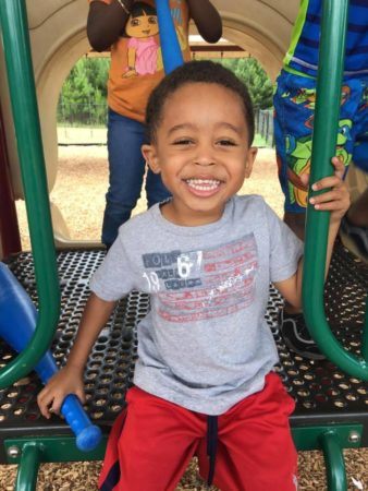 happy_preschooler_on_playground_at_sunbrook_academy_at_luella_mcdonough_ga-338x450