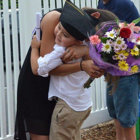 hug_during_pre-kindergarten_graduation_creative_kids_childcare_centers_yorktown-450x450