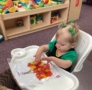 infant playing with art at preschool and daycare at cadence academy preschool smyrna, delaware