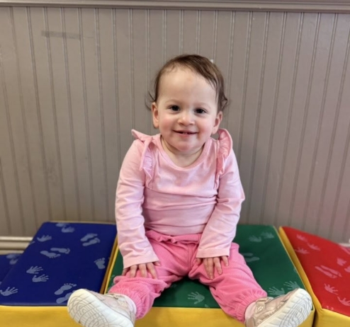 infant smiling on blocks at preschool and daycare at cadence academy preschool forney, texas