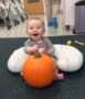 infant_boy_playing_with_pumpkin_at_next_generation_childrens_centers_franklin_ma-383x450