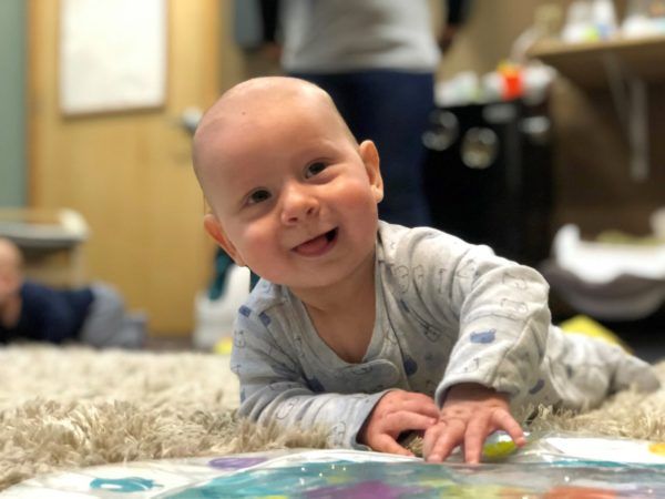 infant_enjoying_tummy_time_cadence_academy_preschool_sellwood_portland_or-600x450