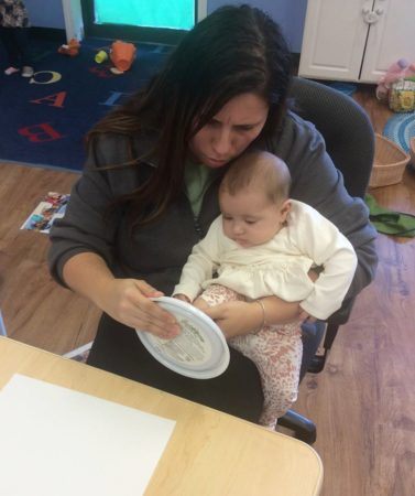 infant_footprint_activity_at_cadence_academy_preschool_seekonk_ma-377x450