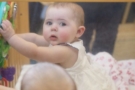 infant_girl_playing_in_crib_at_cadence_academy_preschool_lexington_sc-675x450