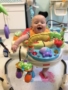 infant_in_bouncer_while_painting_with_feet_at_next_generation_childrens_centers_andover_ma-338x450