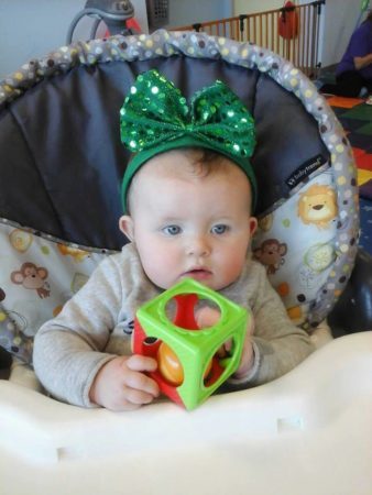 infant_in_st_patricks_high_chair_prime_time_early_learning_centers_paramus_nj-338x450