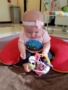 infant_sitting_up_and_playing_with_toy_at_phoenix_childrens_academy_private_preschool_surprise_az-338x450