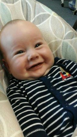 infant_smiling_in_lounger_stonebridge_academy_bremen_ga-253x450