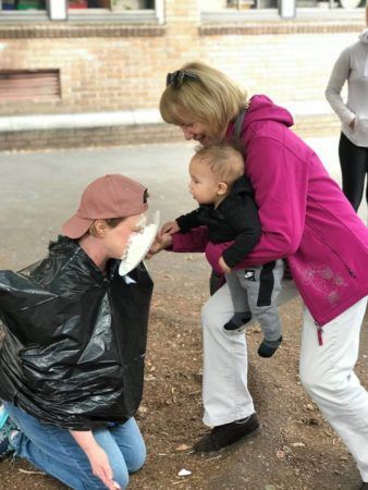 infant_throwing_a_pie_into_teacher_face_cadence_academy_preschool_sellwood_portland_or-338x450