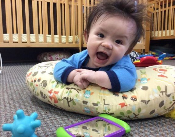 infant_tummy_time_on_lounge_pillow_sunbrook_academy_at_stilesboro_kennesaw_ga-574x450