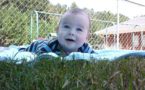 infant_tummy_time_on_the_grass_at_stonebridge_academy_bremen_ga-727x450