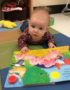 infant_tummy_time_with_pig_book_creative_expressions_learning_center_imperial_mo-349x450