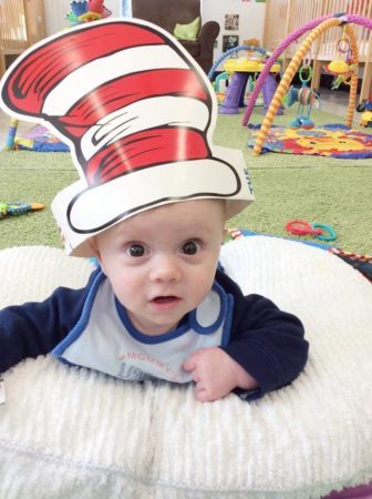 infant_wearing_cat_in_the_hat_gateway_academy_mckee_charlotte_nc-336x450