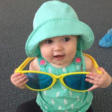 infant_with_large_sunglasses_creative_kids_childcare_centers_yorktown-450x450